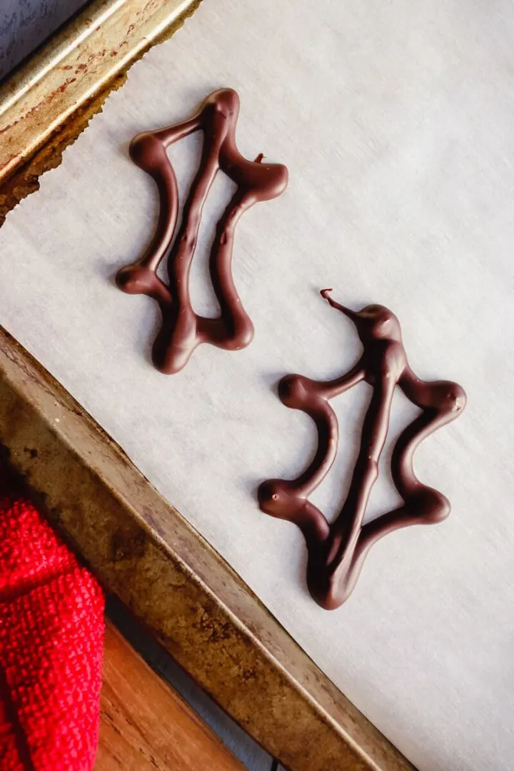 Sugar-free chocolate piped as holly leaves