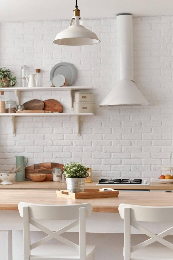 white kitchen with table and chairs