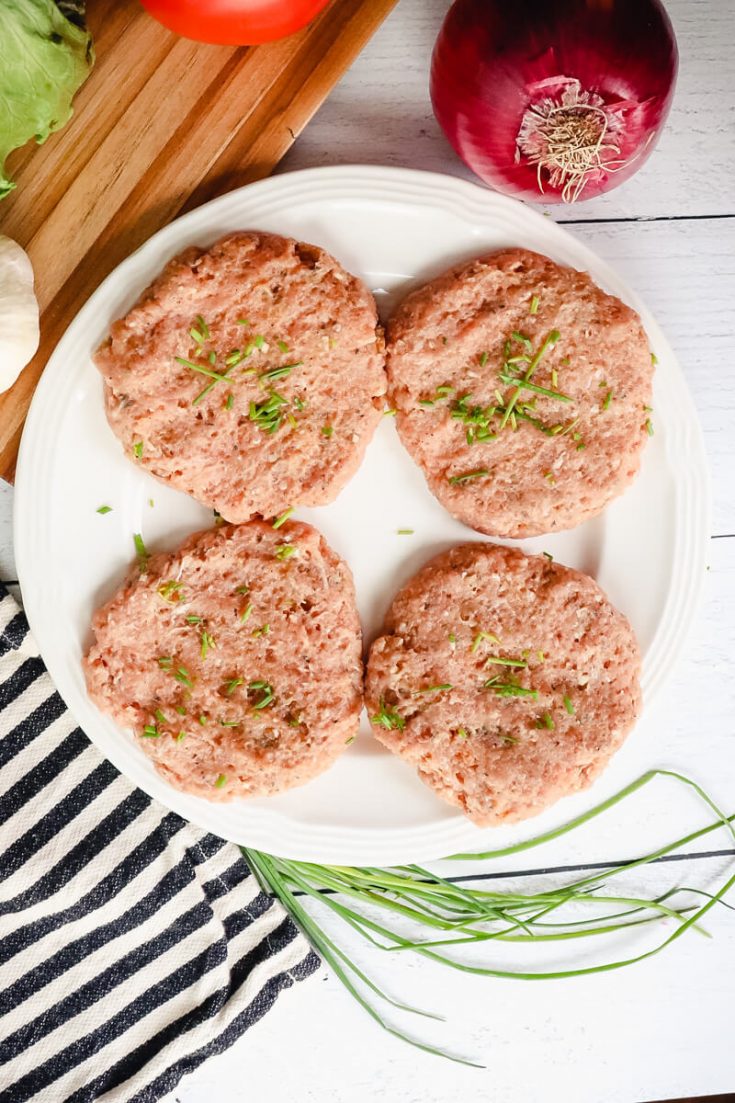 Overhead view of four keto turkey burgers to cook