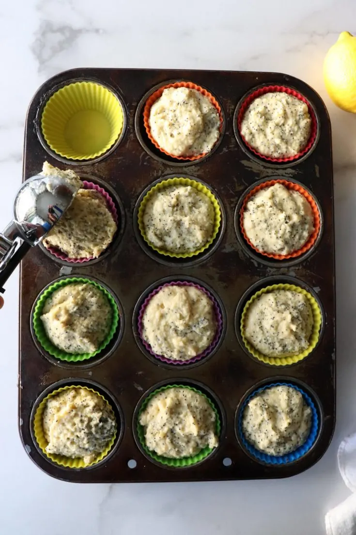 Muffin tin with keto lemon poppy seed muffin batter