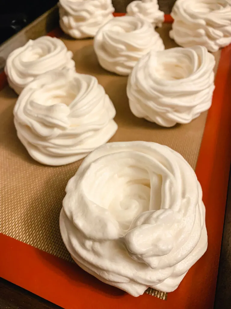Piped meringue nests