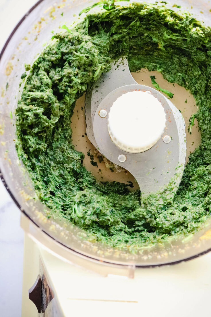 Overhead view of Georgian spinach pkhali in a food processor