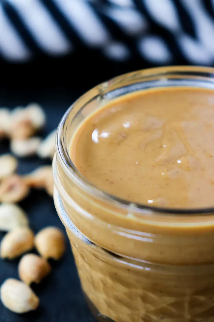 Close up side view of a jar of peanut butter