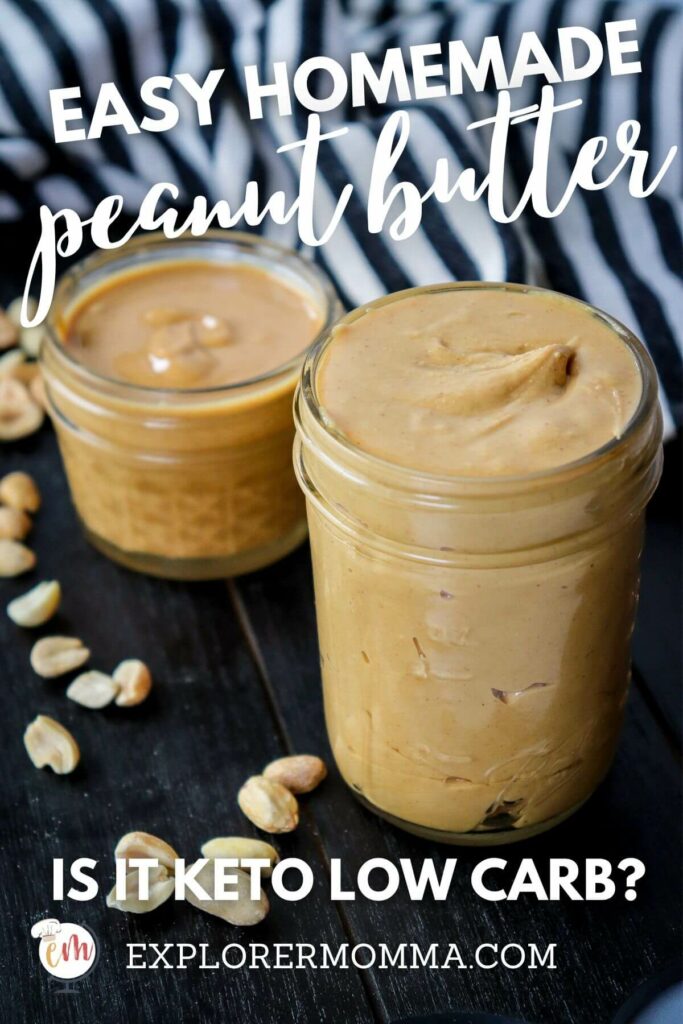 Two jars of peanut butter sitting on a black wooden table