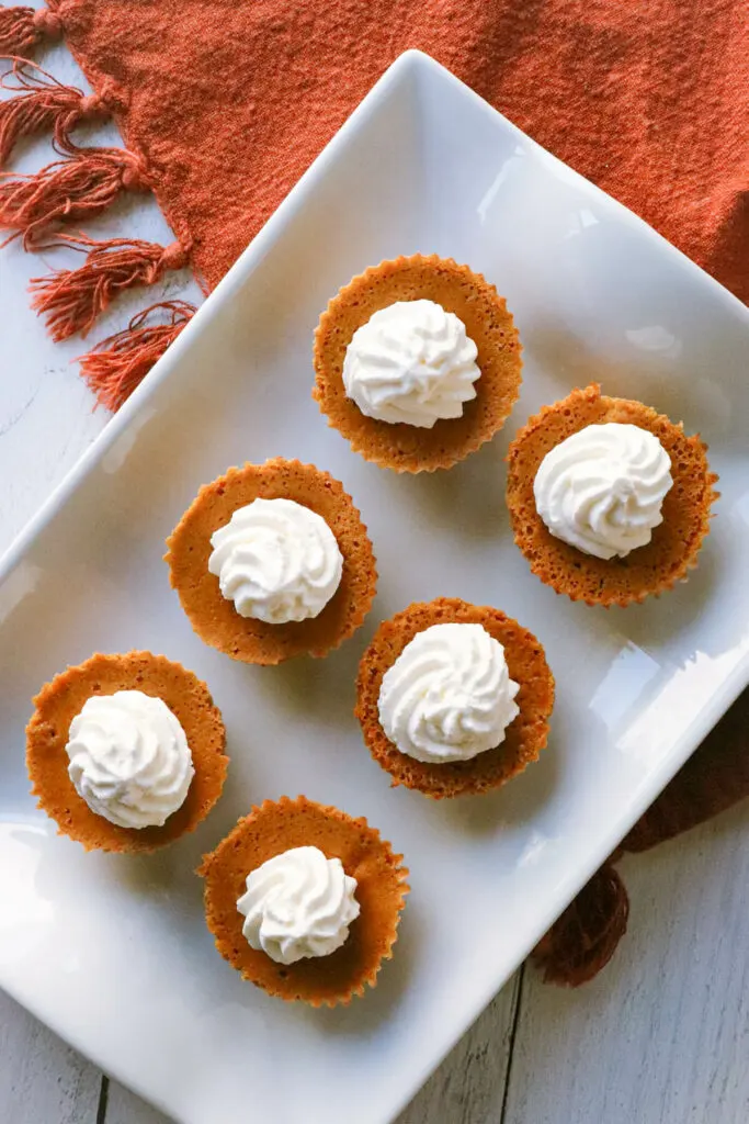 Overhead view of mini low carb pumpkin pies on a plate