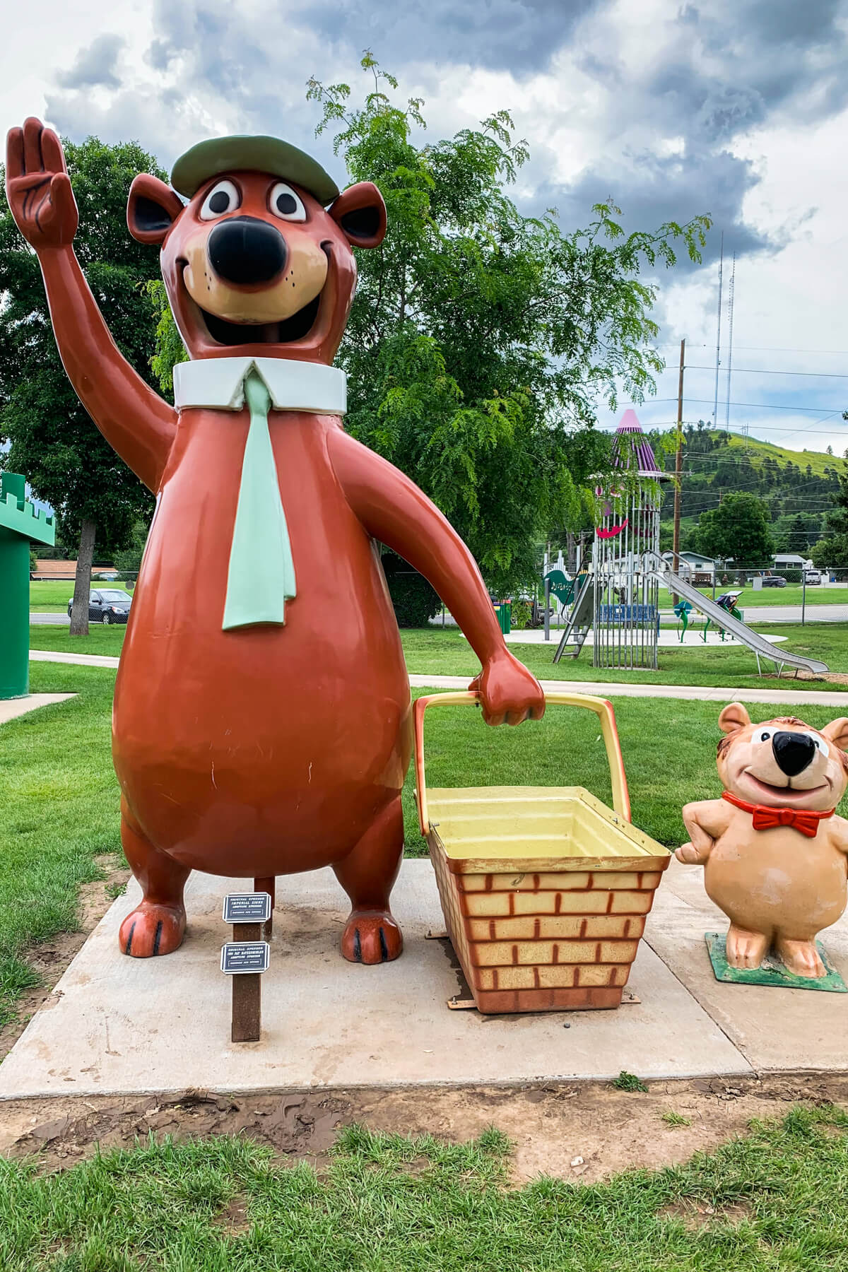 Yogi bear statue and another bear with a picnic basket