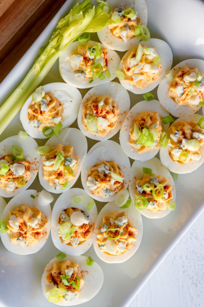 Overhead view of a plate of spicy deviled eggs