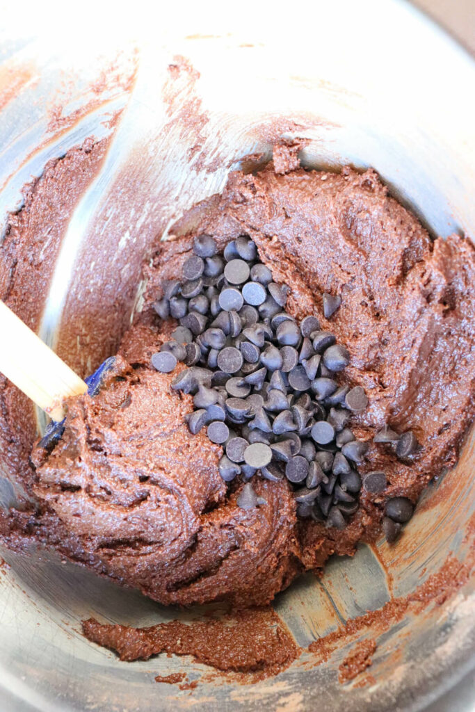 A bowl with keto brownie batter and chocolate chips