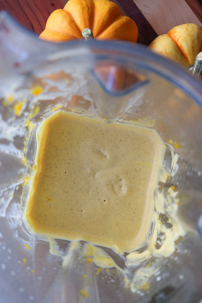 Overhead view of the sugar free pumpkin cheesecake batter in a blender