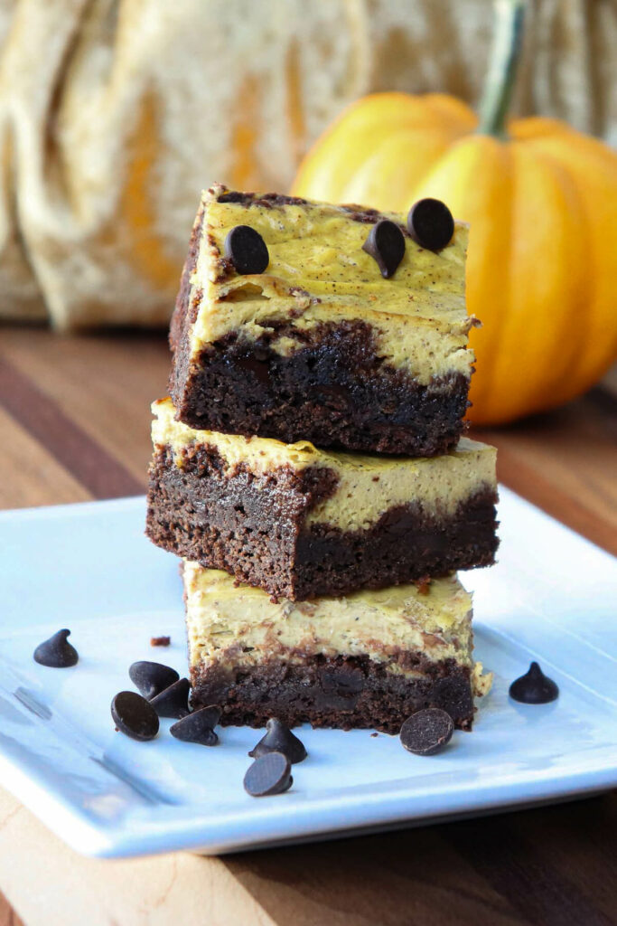 Stack of three keto pumpkin brownies on a plate