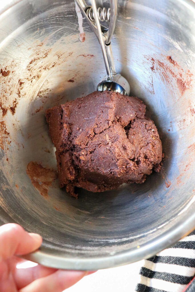 Keto chocolate crinkle cookie dough in a silver metal bowl