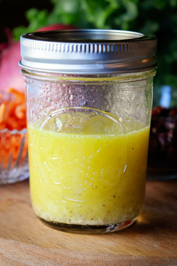 Glass jar with keto lemon salad dressing