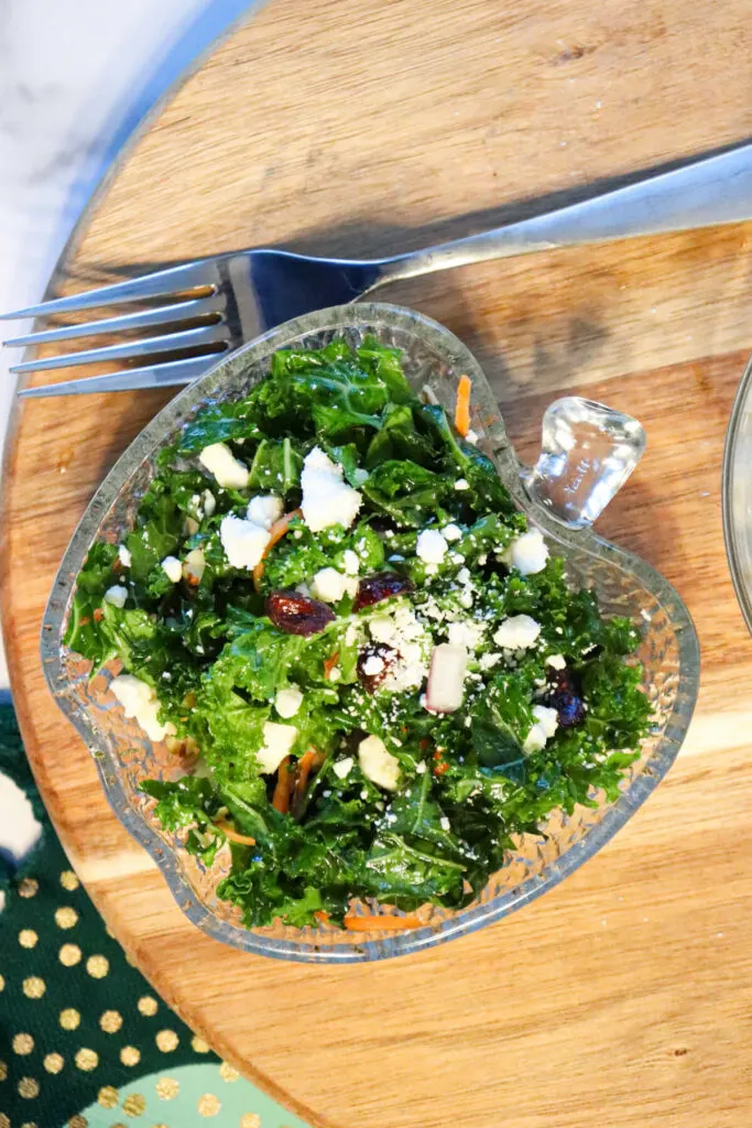 Overhead view of keto kale salad in a glass bowl