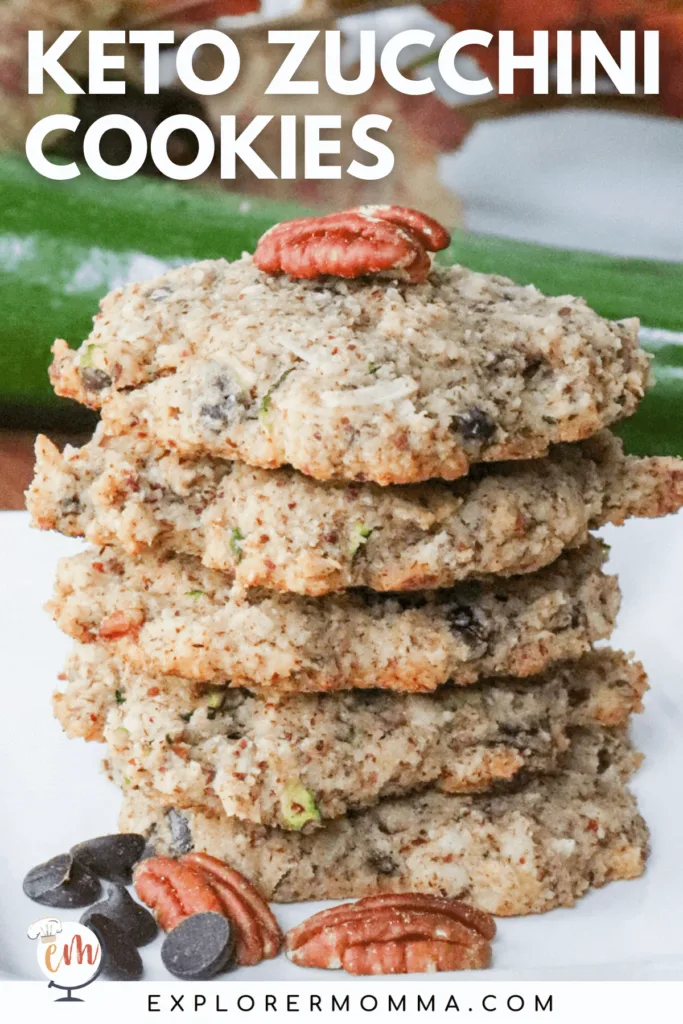 A stack of five keto chocolate chip zucchini cookies with a pecan on top.