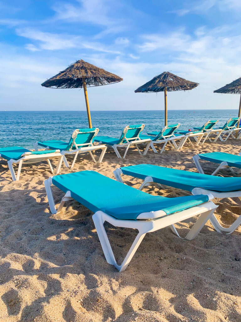 Mediterranean Sea beach with chairs, umbrellas
