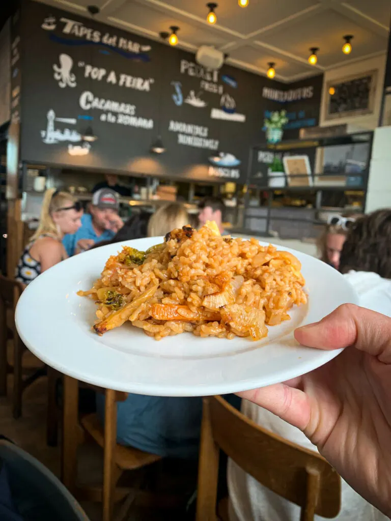 A white plate of Paella