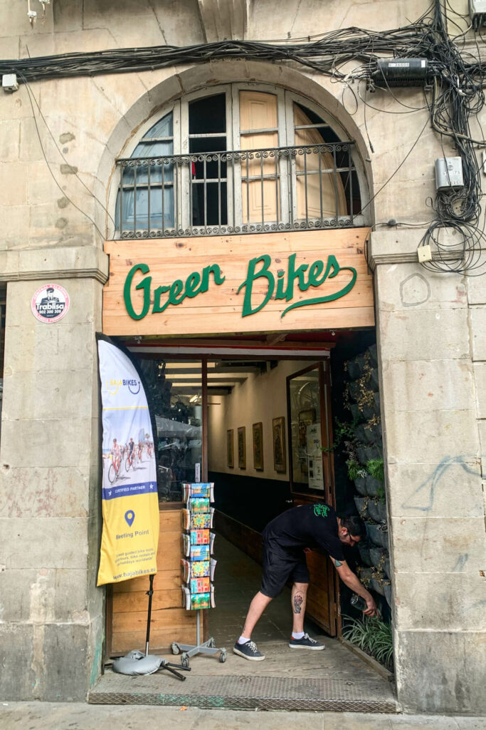 Green bikes sign at city bike tours of Barcelona