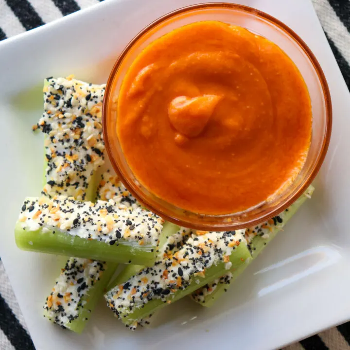 Keto celery snacks with cream cheese, Buffalo sauce, and bagel seasoning