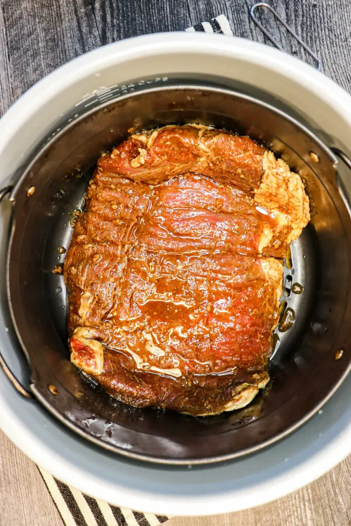 Overhead view of flank steak in Ninja Foodi air fryer