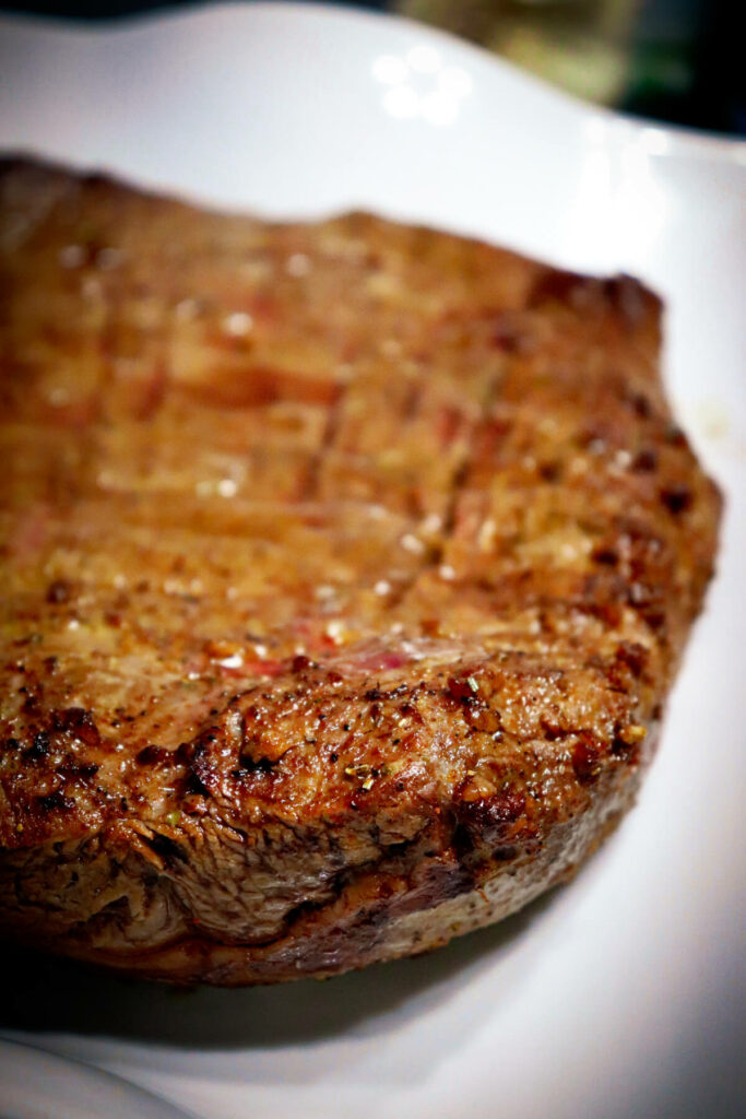 Close up side view of an air fryer flank steak
