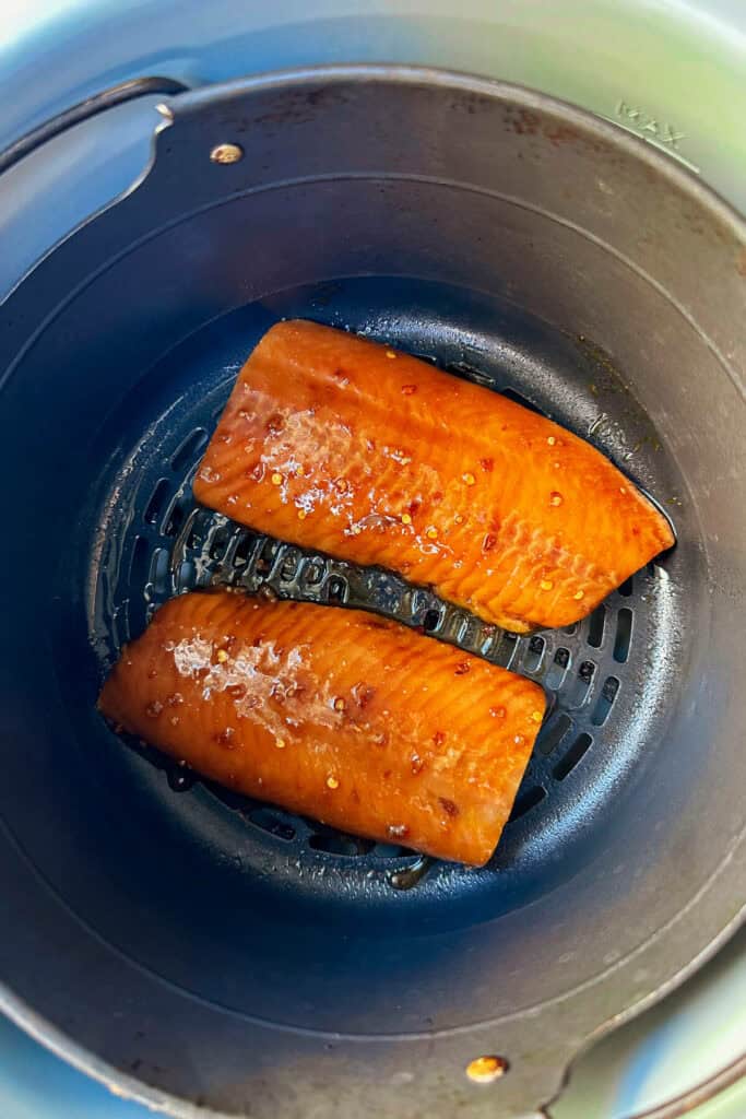 Overhead view of keto air fryer teriyaki salmon in an air fryer basket