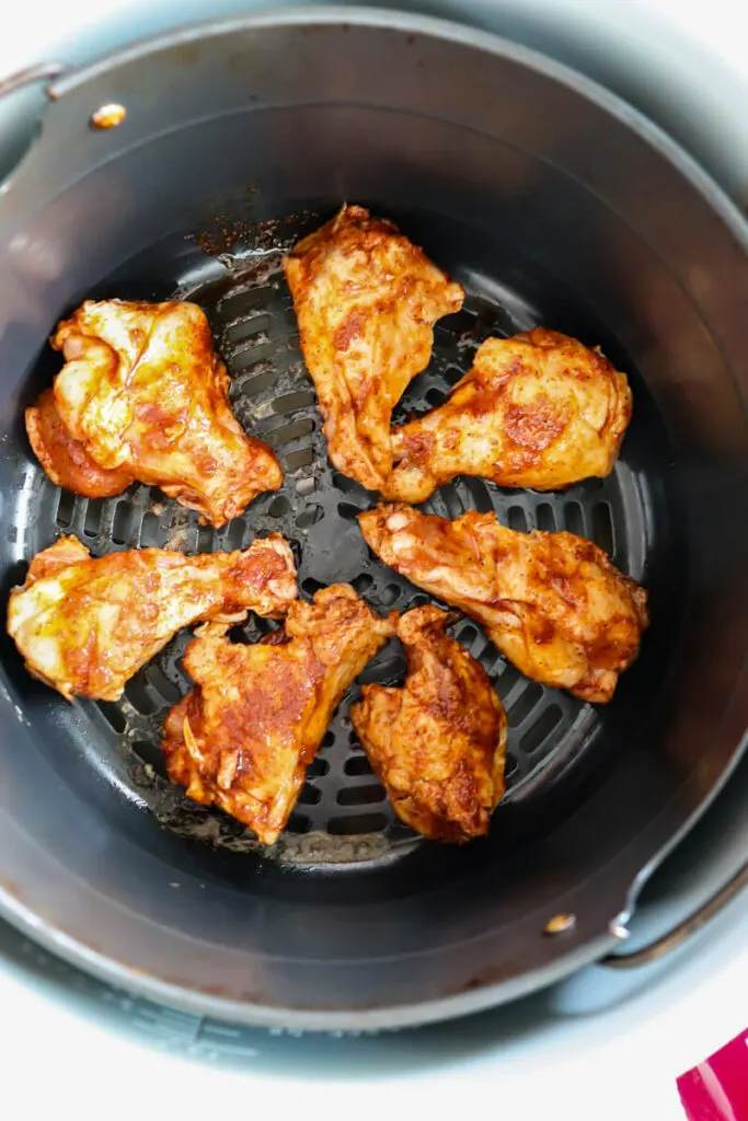 Overhead view of wings in the air fryer