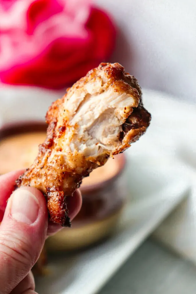 A bite out of the air fryer chicken wing