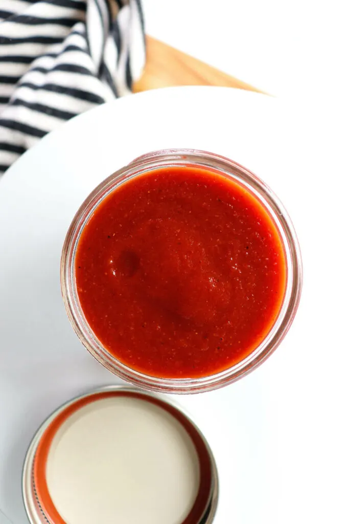 Overhead view of a glass jar of sugar free ketchup