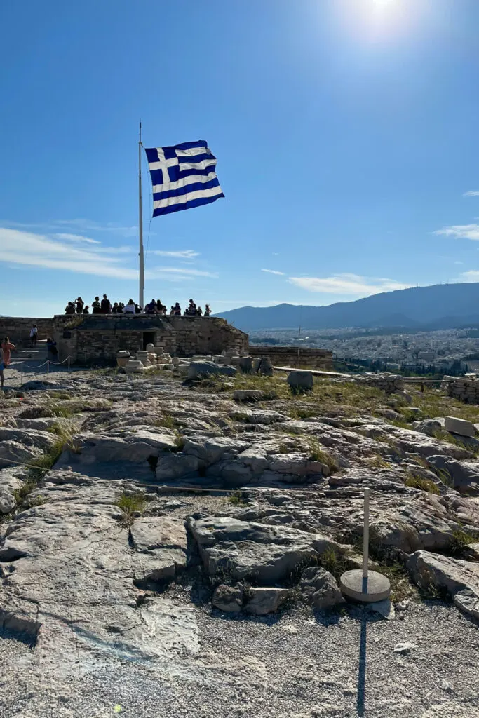 The Greek flag atop the Acropolis