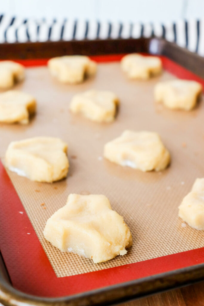 Cookie dough for Greek almond cookies on a baking tray ready to bake