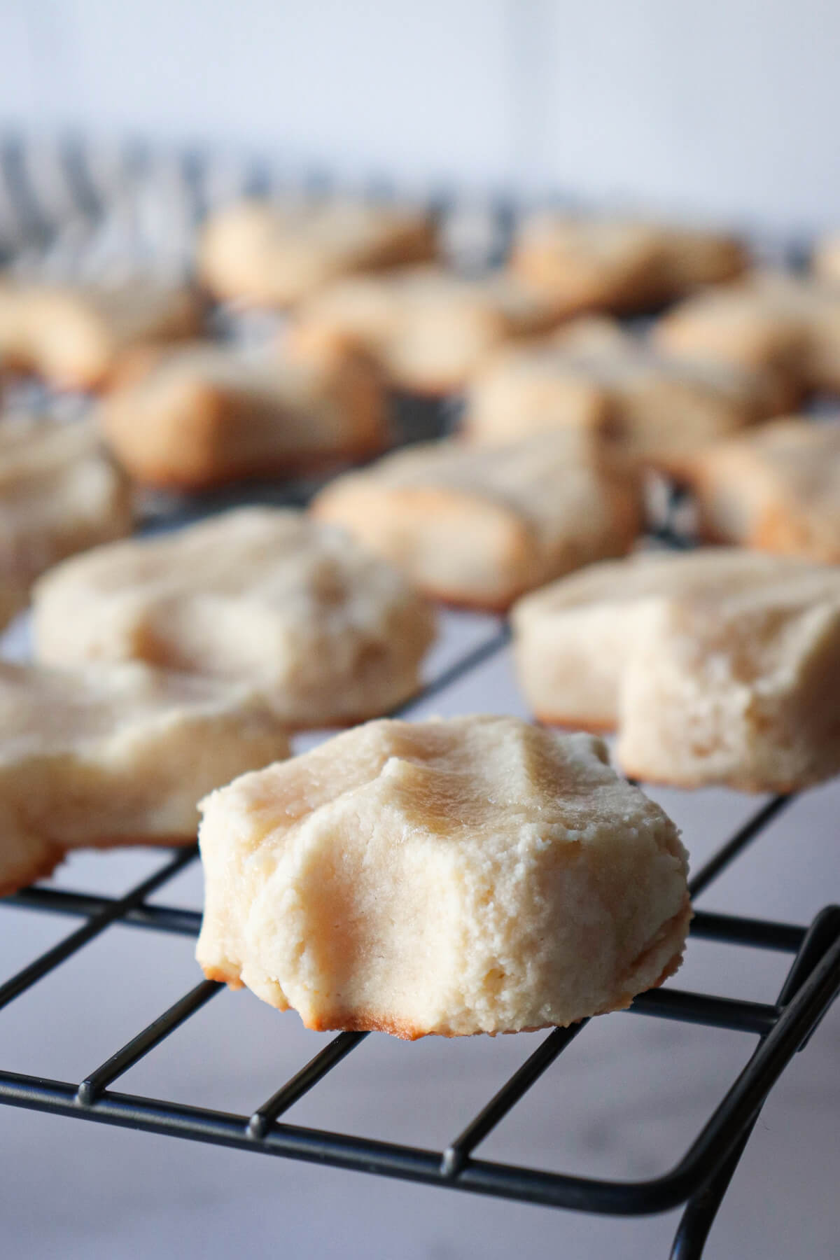 Front view of cooling Greek almond cookies on a rack