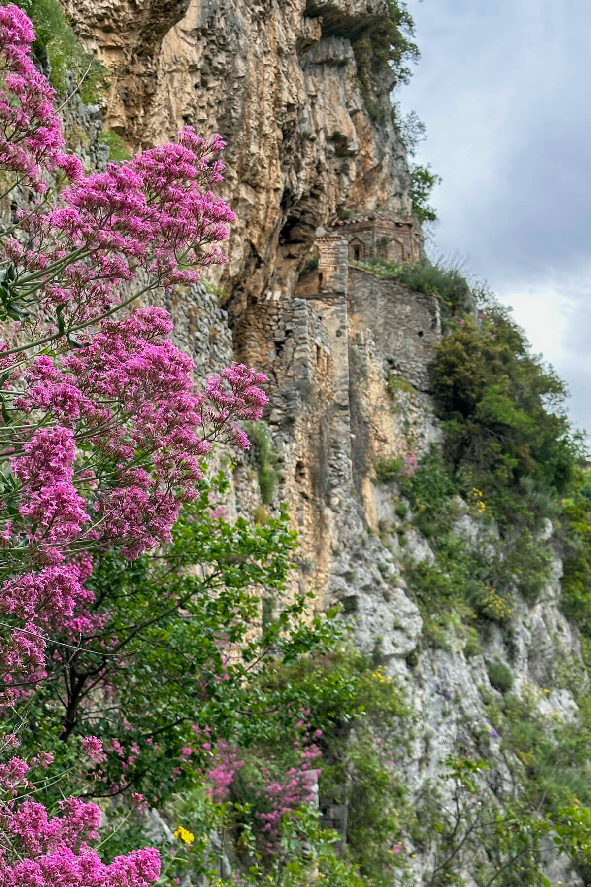 The side of the cliff in the Lousios Gorge with the old Philosopher's Monastery