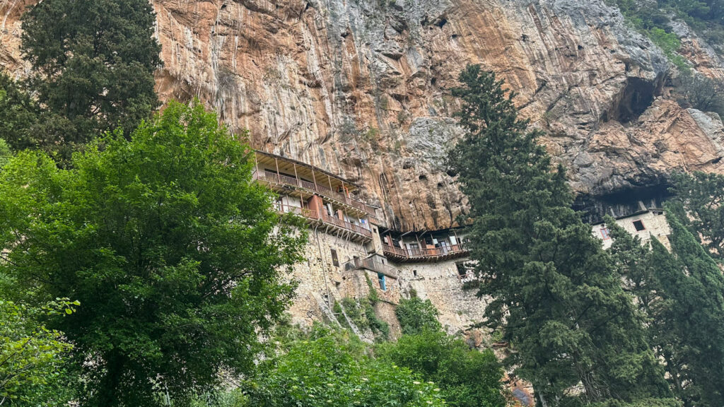 A view of the Prodromos Monastery built into the side of the rock wall