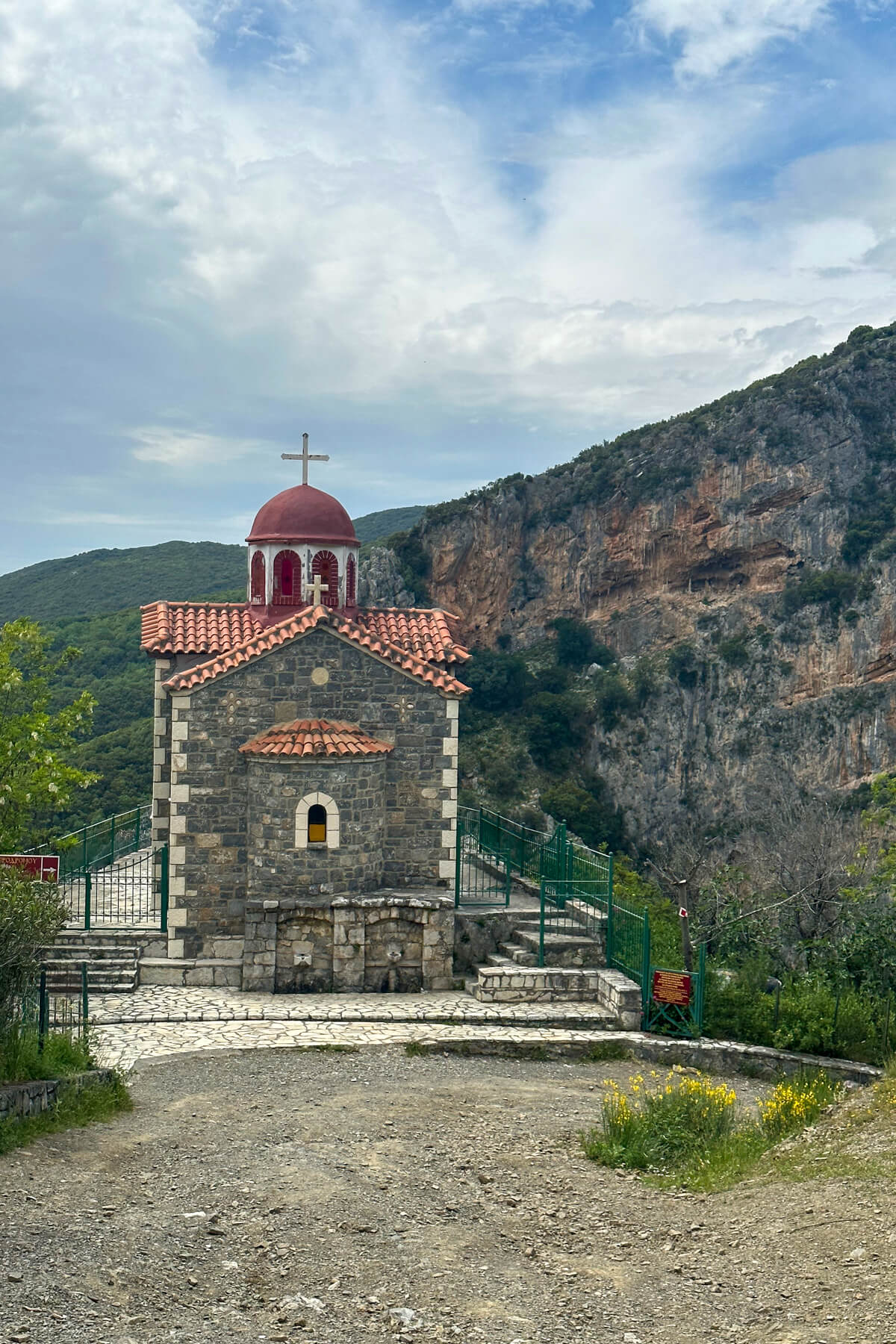 A Greek Orthodox Church with a red roof along the Lousios Gorge
