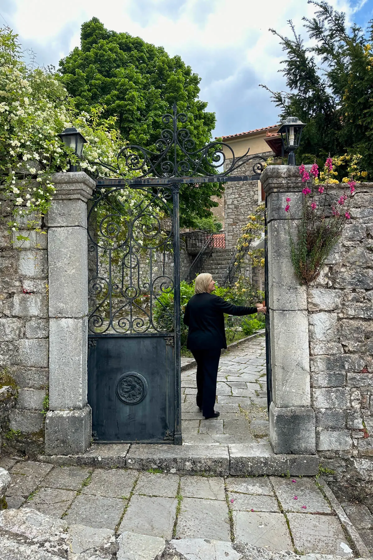 Folklore Museum in Andritsaina entrance with a caretaker opening the gate