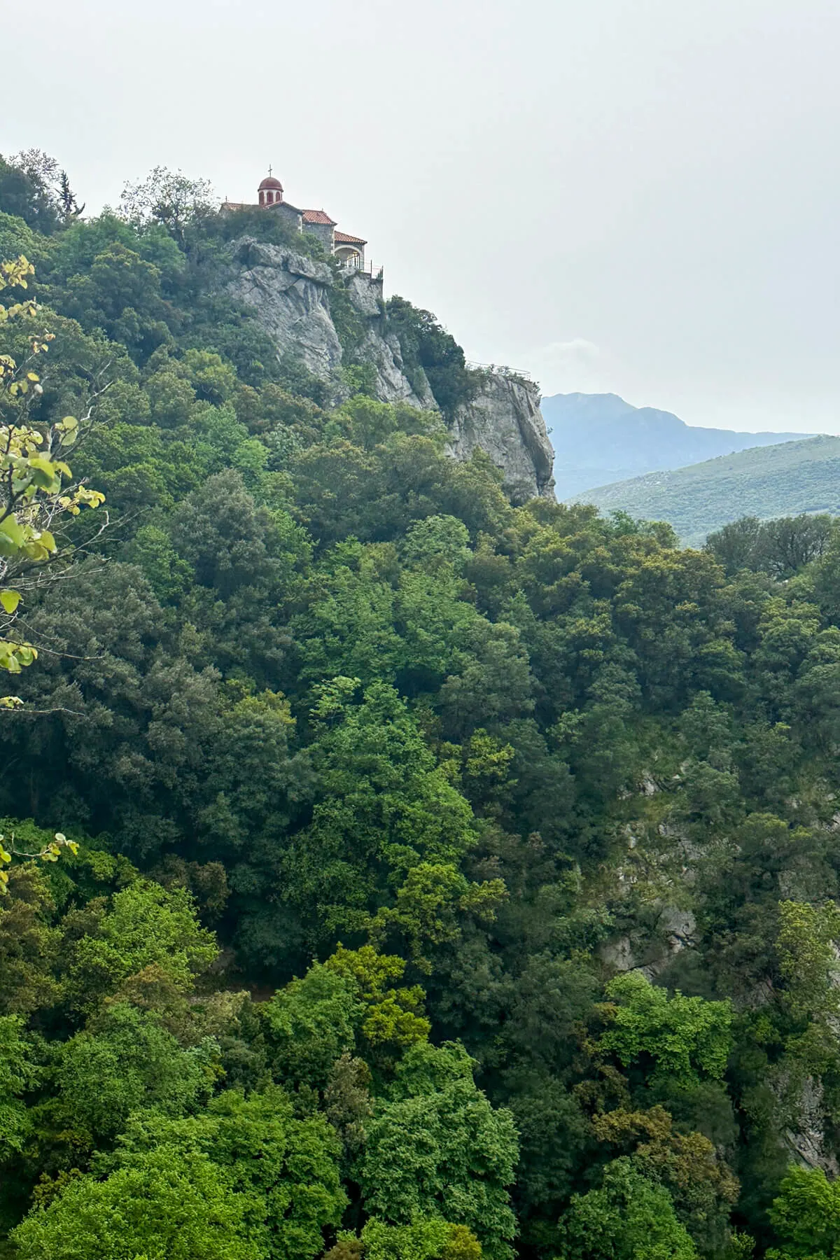 View of a church in the distance on the Menalon Trail