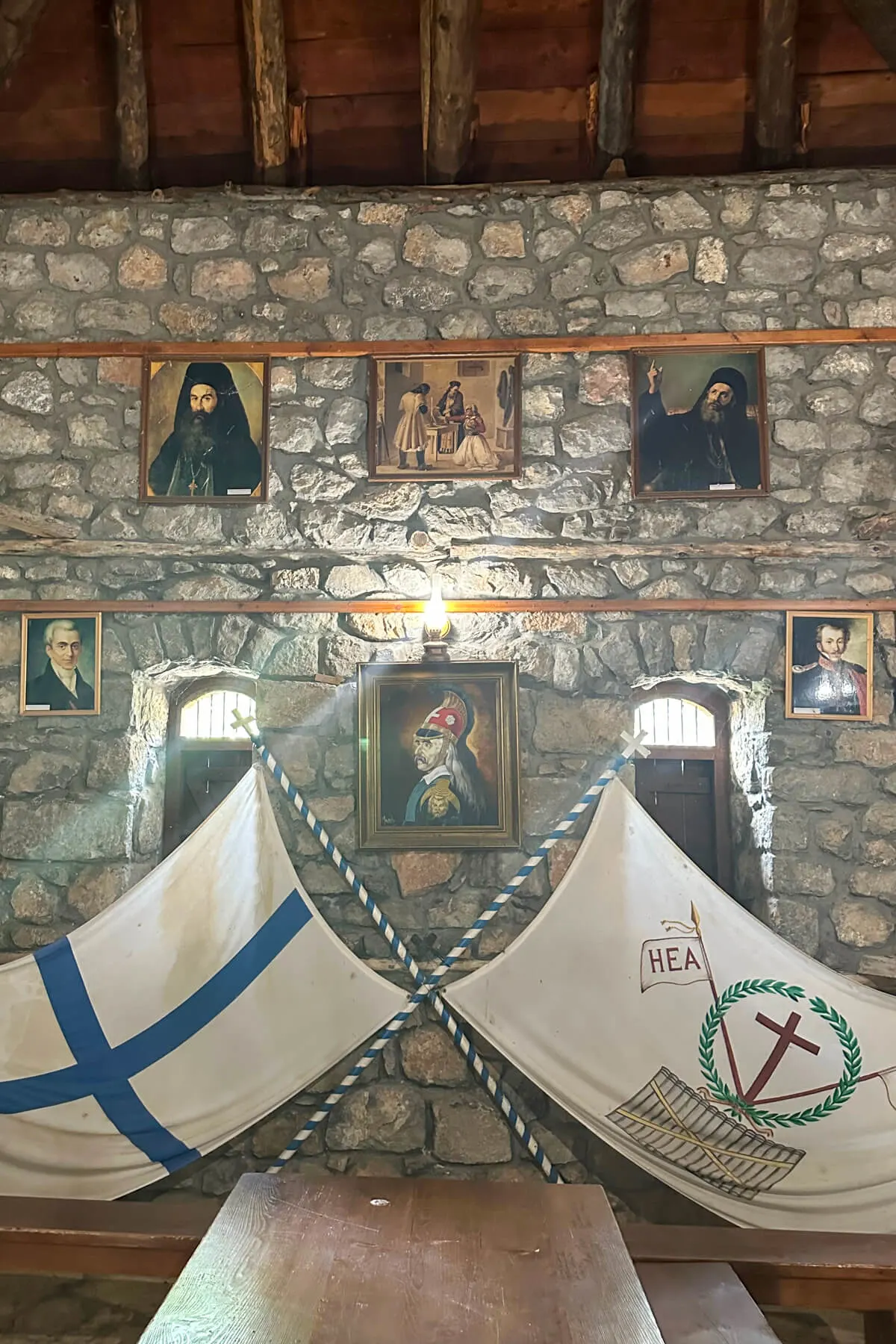 Inside the house of Kolokotronis with Greek flags and portraits of the key figures in the Greek Revolution