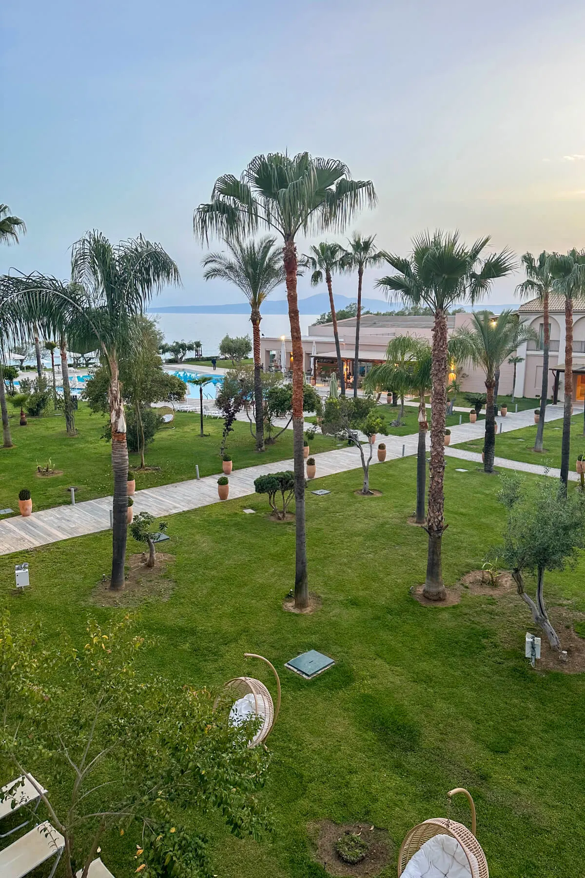 A view of the beach in Kalamata Greece from the Grecotel with palm trees and the breakfast area of the hotel