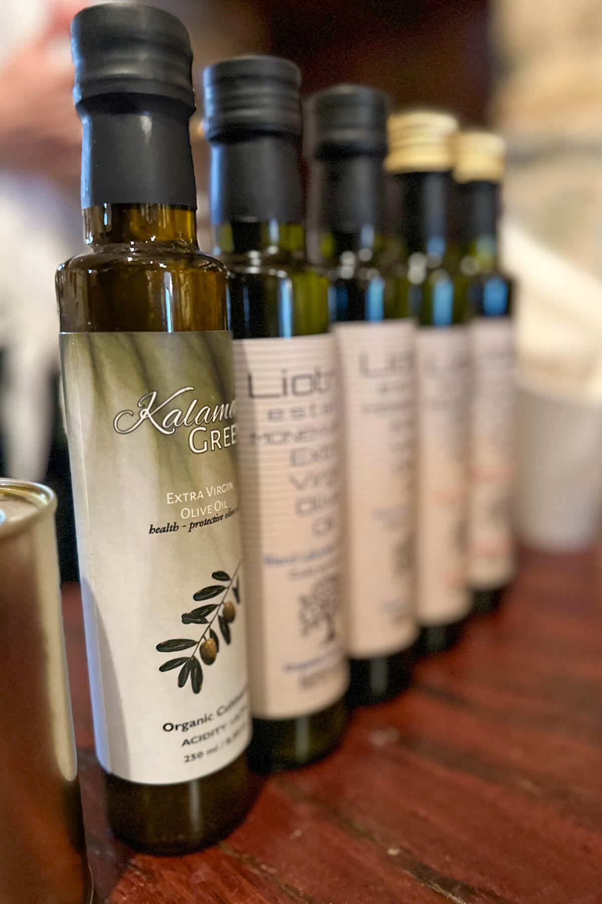 A lineup of the bottles of olive oil ready for the olive oil tasting