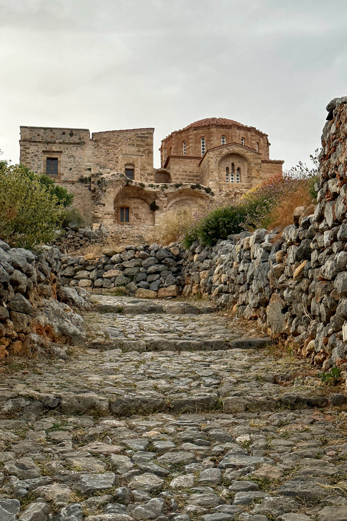 Byzantine Church in Monemvasia Greece with a stone path and walls leading up to it