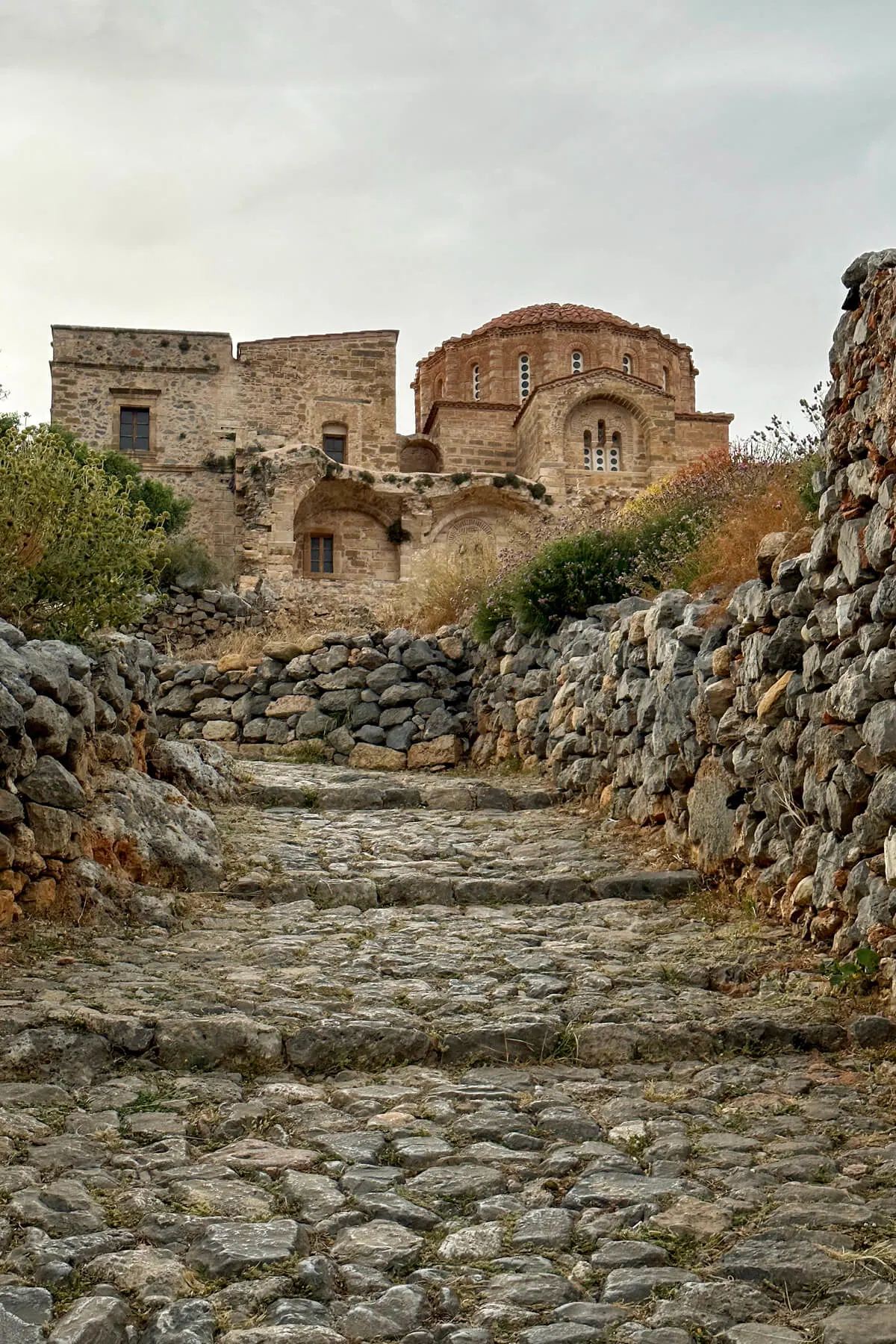 Byzantine Church in Monemvasia Greece with a stone path and walls leading up to it