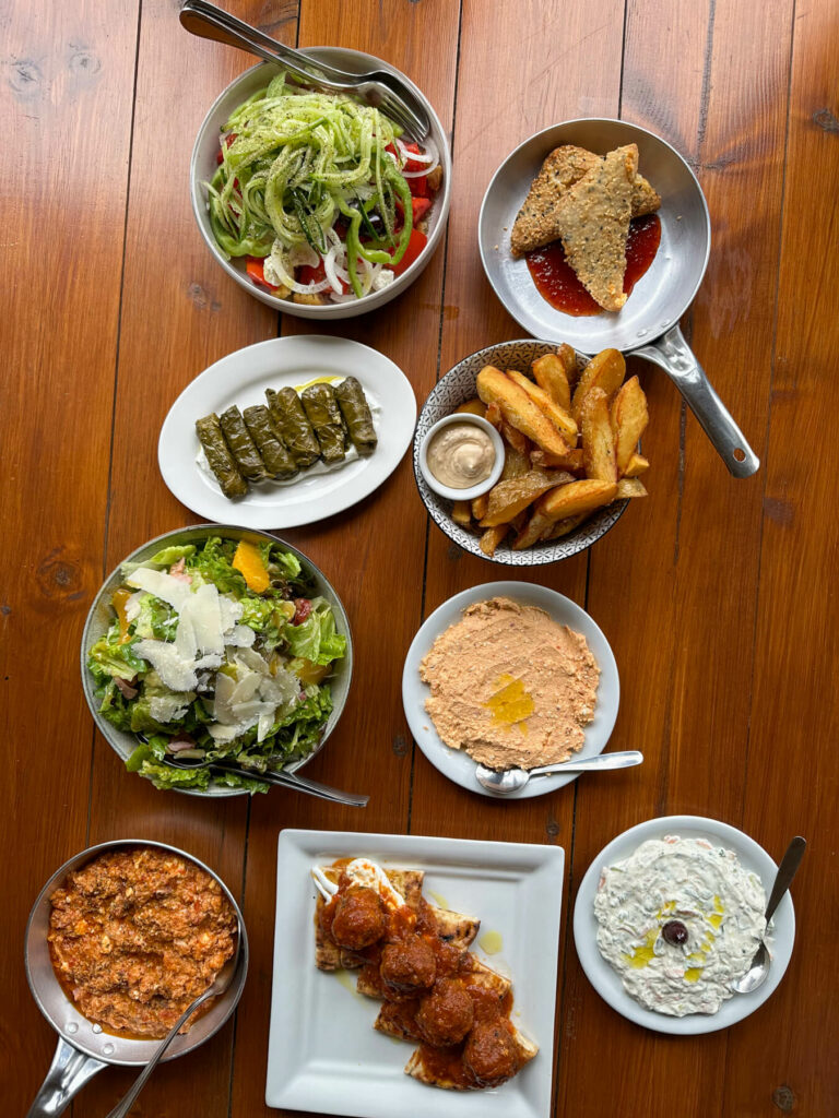 Overhead view of many dishes at the tavern near Mystras