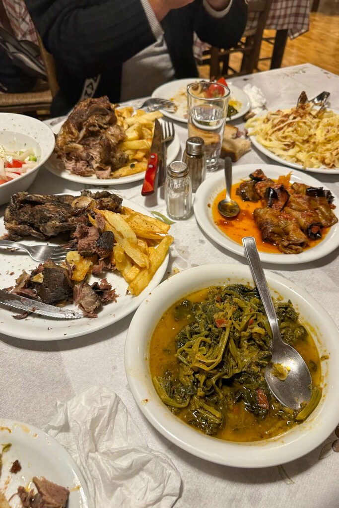 White table full of traditional Greek dishes at Zerzova Restaurant Dimitsana Greece