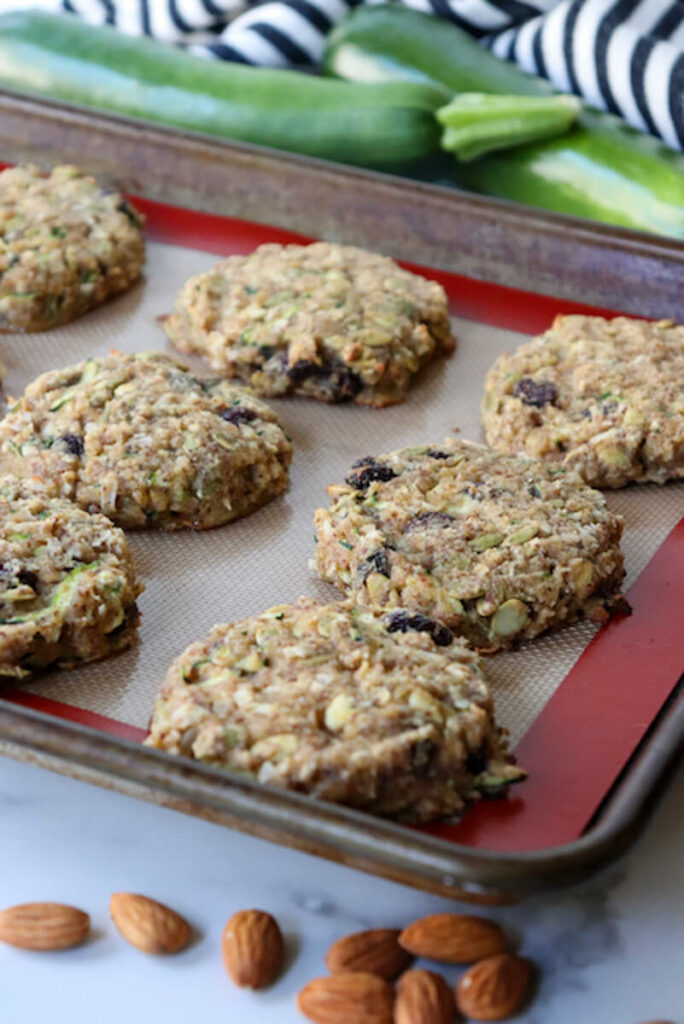 Zucchini keto breakfast cookies just baked on a cookie pan with a silicon liner