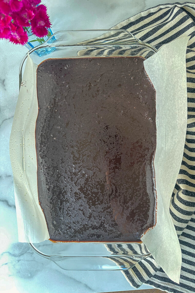 Overhead view of keto zucchini brownies with glaze just spread on.