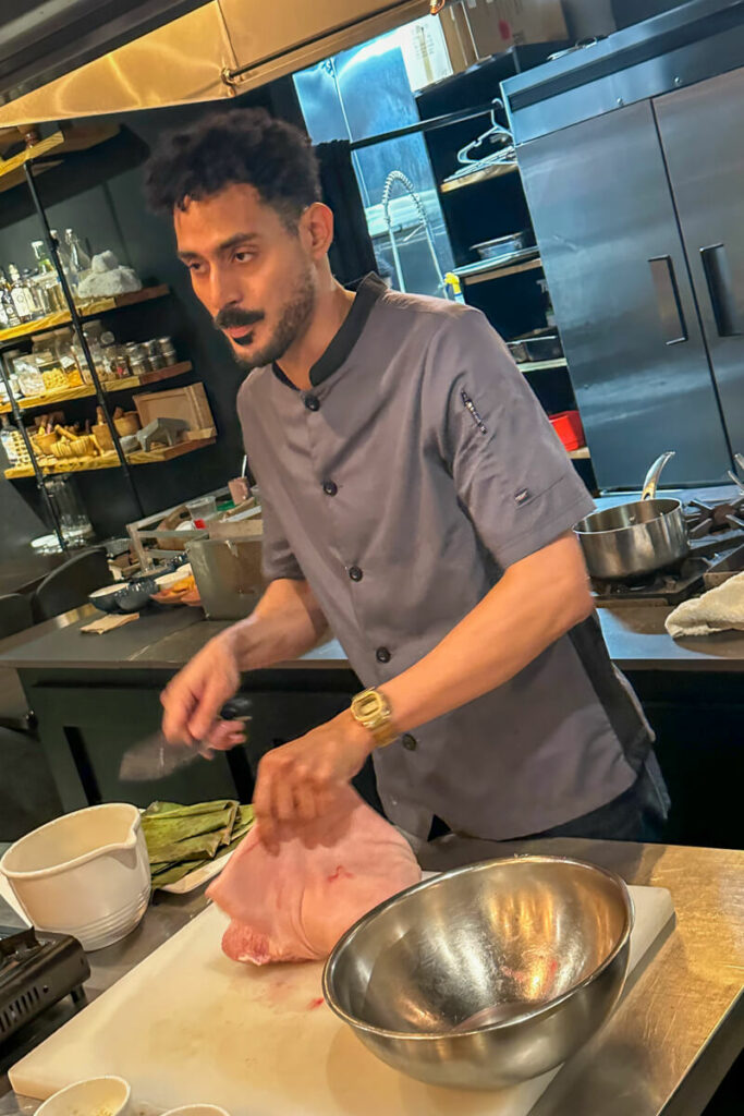 Chef removing the pork bone