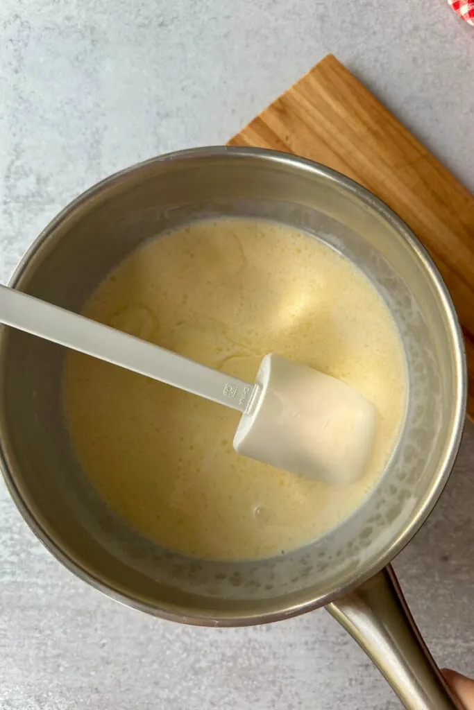 Overhead view of the mixture in a silver saucepan