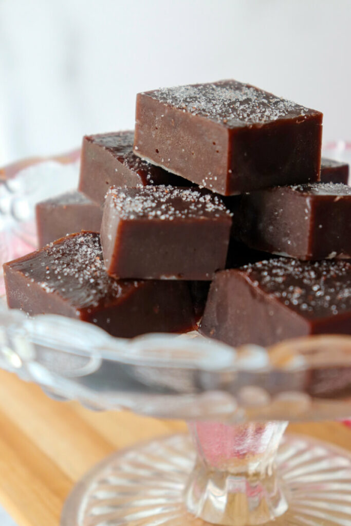 A stack of keto protein fudge on a glass dish