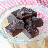 A stack of keto protein fudge on a glass dish