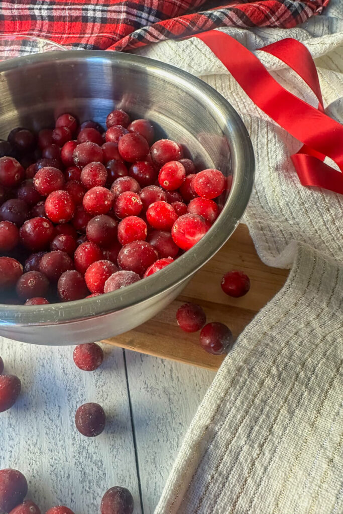 Front view of metal bowl of cranberries